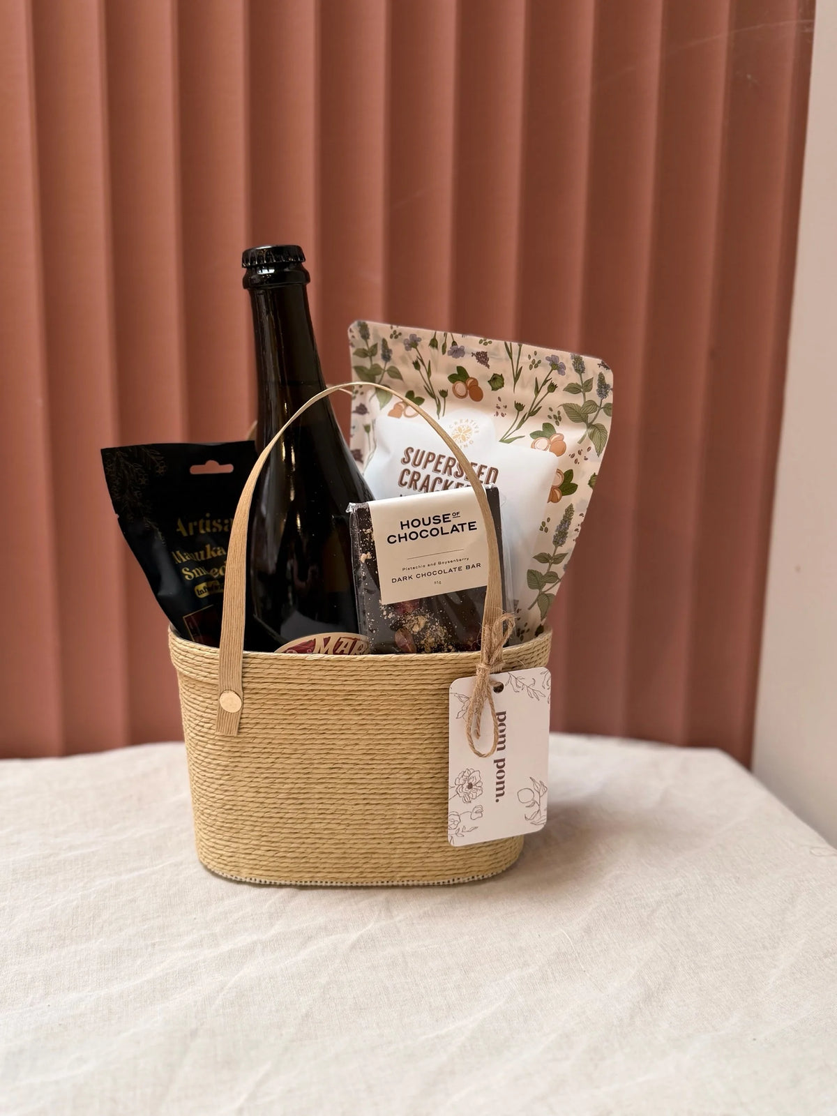 Boujee Basket gift hamper with wine and gourmet treats in a woven basket