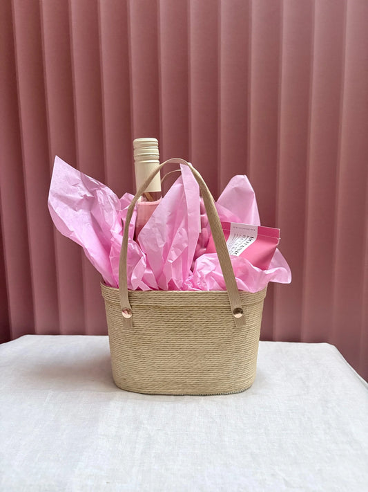 Woven Pinky gift basket wrapped with pink tissue