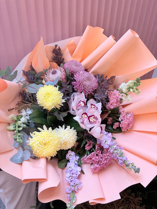 Boujee Babe bouquet of lilac, yellow chrysanthemums and pastels in pink wrap