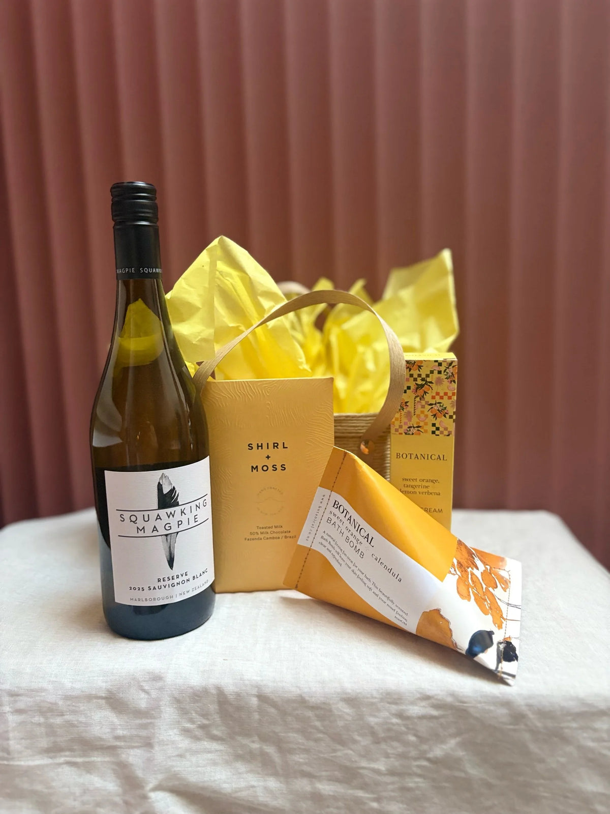 Sunshine gift basket with white wine and yellow tissue