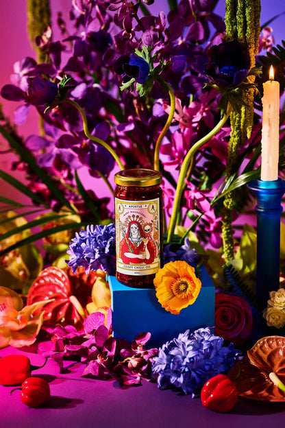 Apostle Mary Magdalene chilli oil styled with purple flowers