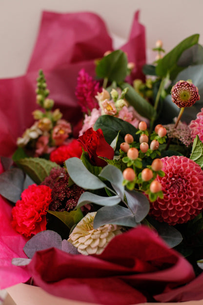 Seasonal Lovers bouquet of red roses, berries and eucalyptus