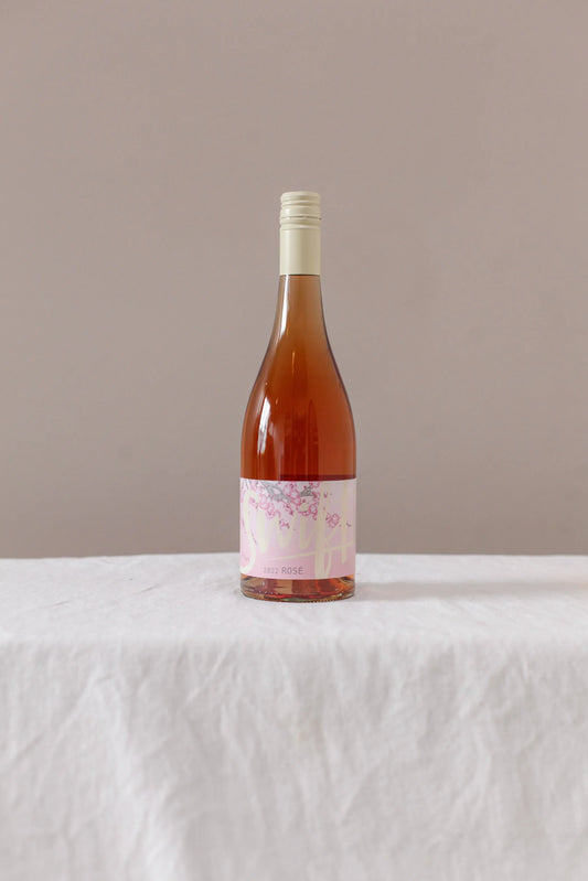 Swift Wines Rosé 2022 bottle on a linen-draped table