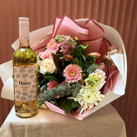 Squawking Magpie Daisy wine with a pink gerbera and rose bouquet