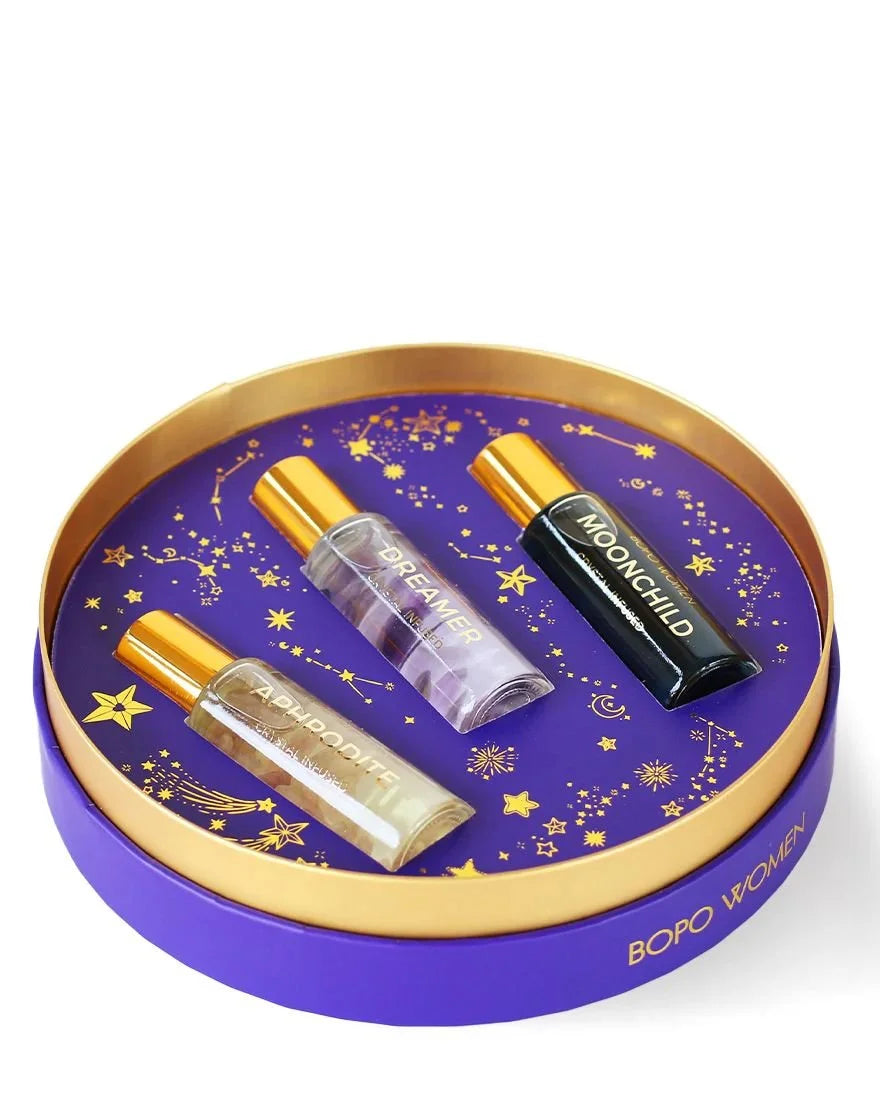 Open perfume roller trio tin with three rollerball perfumes