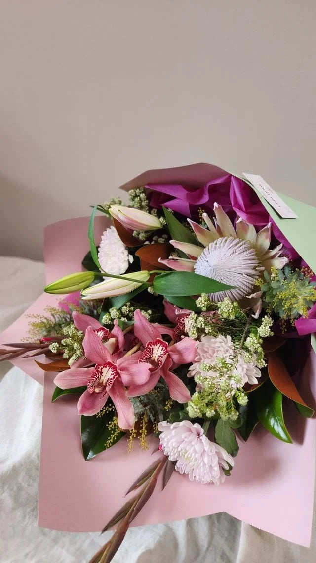 Lush pink orchid and lily bouquet, Hastings flower delivery
